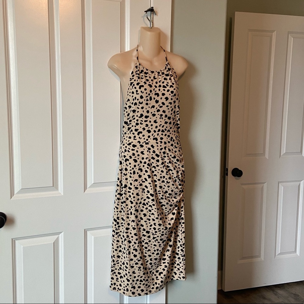 Animal print dress, ruched on the side, ties around the neck.